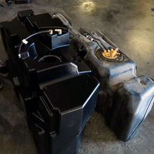 Load image into Gallery viewer, The 62-gallon aftermarket fuel tank for GM Duramax beside a vehicle for scale