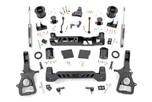 Load image into Gallery viewer, Components of the 6-inch lift kit for Ram 1500, including suspension parts and steering knuckles