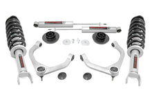 Load image into Gallery viewer, Components of the lift kit featuring front struts, rear shocks, and springs for 2019+ Ram 1500
