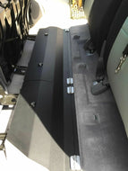 Interior shot of a Toyota Tacoma showcasing the spacious lockable under back seat storage unit.