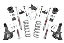 Load image into Gallery viewer, Components of the 6-inch lift kit for Ram 1500 2WD, including springs and shocks
