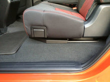 Load image into Gallery viewer, Toyota Tundra CrewMax seat showcasing the black storage system beneath