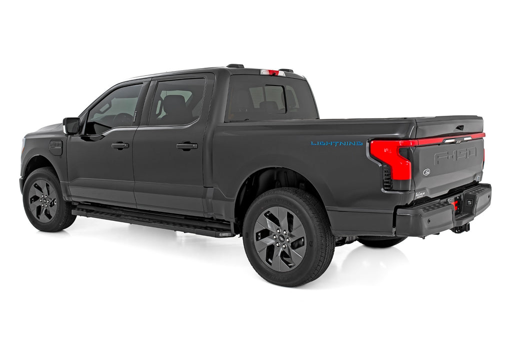 Rear view of a Ford F-150 Lightning equipped with a 3/4 inch Rough Country leveling kit