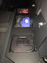 Load image into Gallery viewer, Detailed image of the lockable storage compartment under the seat in a Toyota Tundra CrewMax