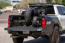 Load image into Gallery viewer, DV8 Offroad Truck Bed Universal Tire Carrier &amp; Accessory Mount