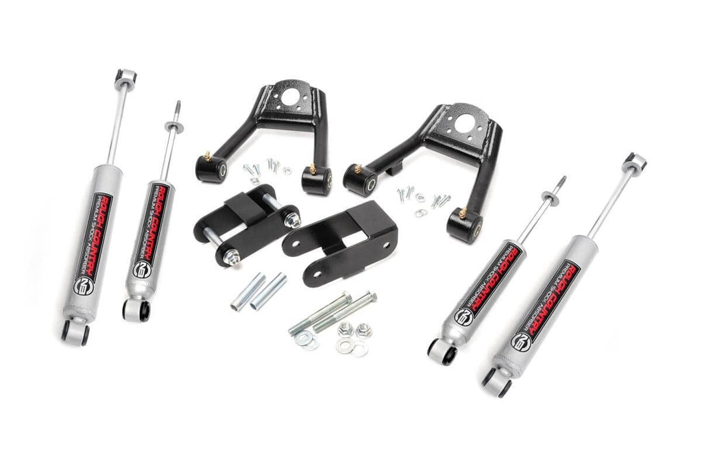 Lift kit components for 1.5-2 inch height increase designed for Nissan D21 Hardbody 4WD, including front and rear suspension parts