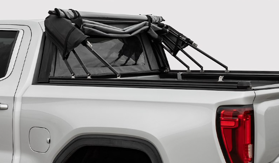 White Chevy/GMC Colorado/Canyon equipped with an Access Outlander soft truck bed cover for a 6ft box