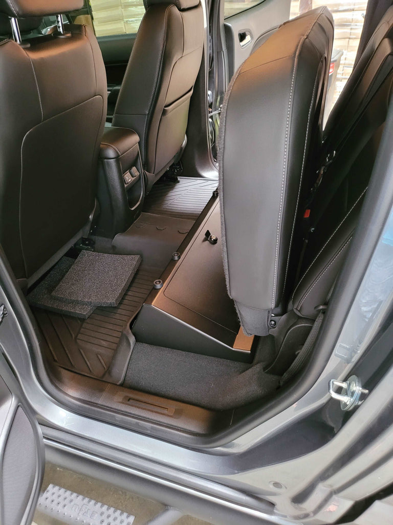 Chevrolet Colorado's with rear seats folded to reveal storage space