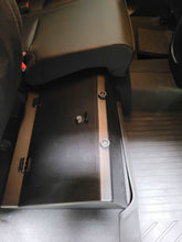 Load image into Gallery viewer, Interior view of a Chevrolet Colorado showing the under-seat lockable storage box