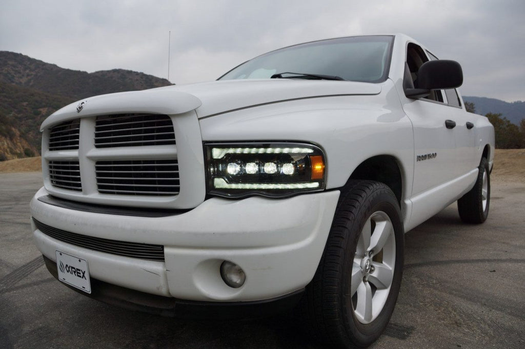 AlphaRex 02-05 Dodge Ram 1500 NOVA LED Proj Headlights Plank Style Blk w/Activ Light/Seq Signal