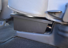 Load image into Gallery viewer, Under-seat lockable storage box installed in the rear of a Ford F-Series cab