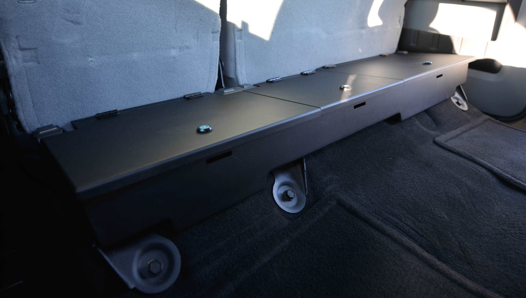 Lockable storage unit designed to fit under the seat of a 2003-2016 Ford F-Series truck
