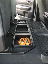 Load image into Gallery viewer, Rear seat storage solution for Tundra models featuring shoe compartments