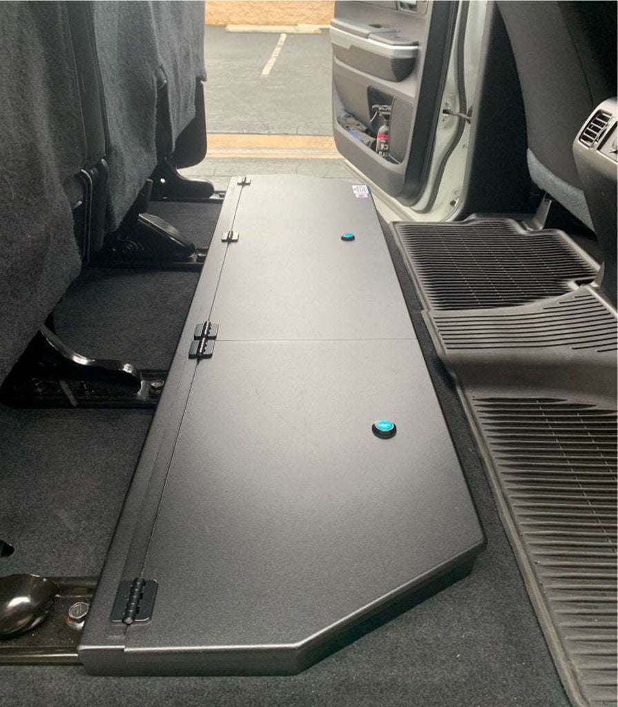 Organized under seat storage in Toyota Tundra CrewMax with seat cover and integrated tray system