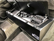 Load image into Gallery viewer, Chevrolet Colorado&#39;s under-seat storage area with a firearm for demonstration of lockable space