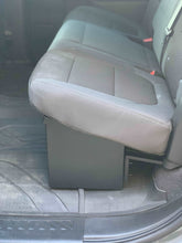 Load image into Gallery viewer, Fitted protective seat cover above the lockable storage in a 2019-2024 Chevrolet Silverado