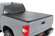 Load image into Gallery viewer, Hard Tri-Fold Flip Up Bed Cover - 5'7 In. Bed - Toyota Tundra (07-21)