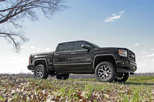Load image into Gallery viewer, Chevy GMC 1500 truck equipped with a 6-inch Rough Country lift kit, displayed outdoors