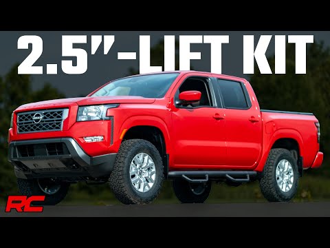 Nissan Frontier equipped with a 2.5 Inch Lift Kit parked off-road