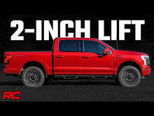 Load image into Gallery viewer, Ford F-150 Lightning 4WD with a 2-inch leveling kit installed, showcasing the enhanced stance