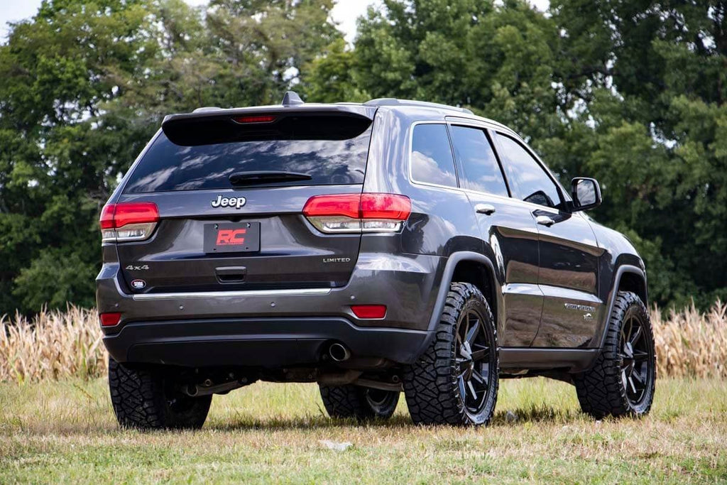 Jeep Grand Cherokee equipped with a 2.5-inch N3 strut lift kit on an off-road terrain