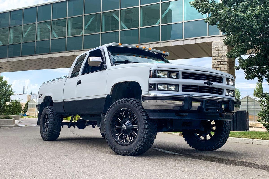 Chevy GMC C1500 K1500 4WD truck equipped with a 6-inch Rough Country lift kit, displayed outdoors