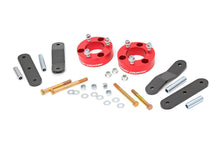 Load image into Gallery viewer, Components of a 2.5 Inch Lift Kit for Nissan Frontier and Xterra models