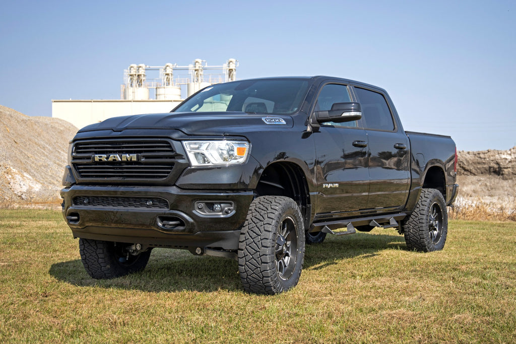 Ram 1500 equipped with a 6-inch Rough Country lift kit, showcased in an outdoor setting