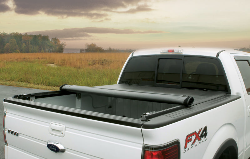 Dodge Dakota equipped with Lund Genesis Roll Up Tonneau Cover in white