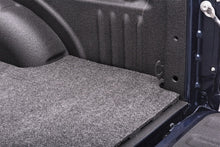 Load image into Gallery viewer, Interior view of Honda Ridgeline&#39;s rear seats with BedRug carpeting