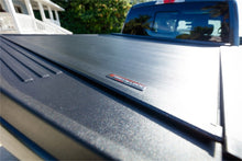 Load image into Gallery viewer, Roll-N-Lock 15-20 Ford F-150 77-3/8in E-Series Retractable Tonneau Cover