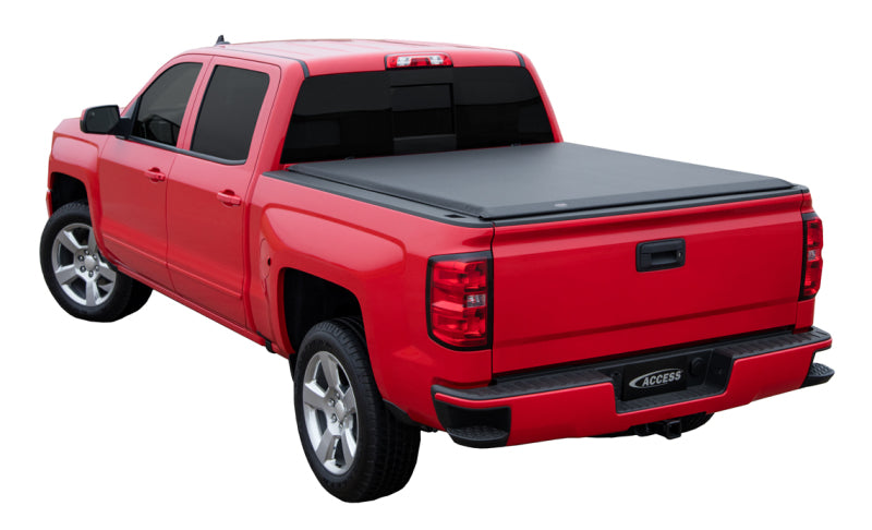 Red Chevrolet/GMC full-size truck with Access Original roll-up cover installed