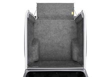 Load image into Gallery viewer, Open trunk of a Nissan vehicle displaying the gray BedRug protection