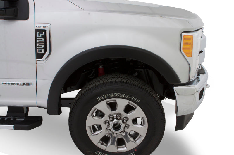 Detailed view of Bushwacker OE Style Flare fitting on a Ford Excursion wheel well