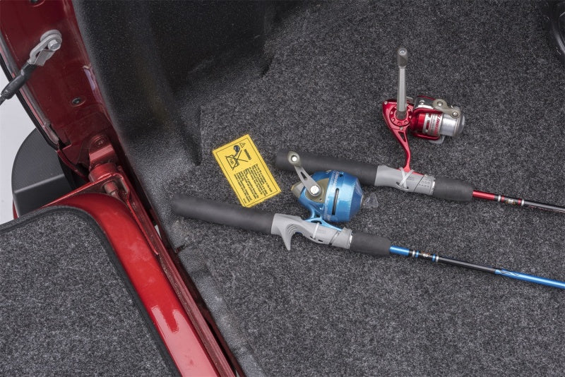 BedRug mat in the cargo area of a Honda Ridgeline providing a surface for fishing gear