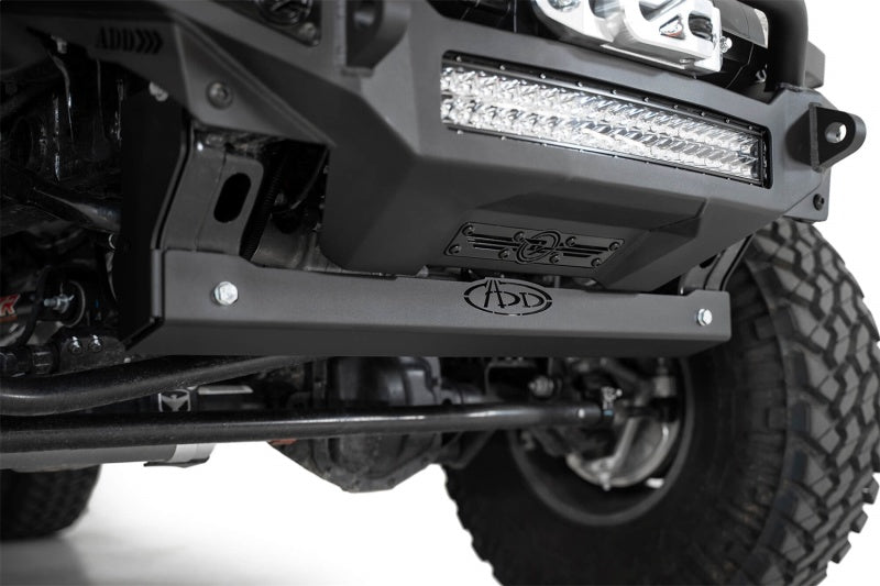 Addictive Desert Designs sway bar skid plate mounted on a Jeep JL with upgraded lights