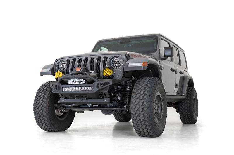 Gray Jeep JL equipped with Addictive Desert Designs front bumper and sway bar skid plate