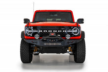 Load image into Gallery viewer, Detailed view of the Addictive Desert Designs Rock Fighter Skid Plate on a red Ford Bronco