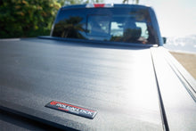 Load image into Gallery viewer, Roll-N-Lock Chevy Silverado / GMC Sierra 2500-3500 77-3/8in E-Series Retractable Tonneau Cover