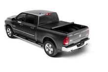 Load image into Gallery viewer, Black Dodge Dakota showcasing the Lund Genesis roll-up tonneau cover