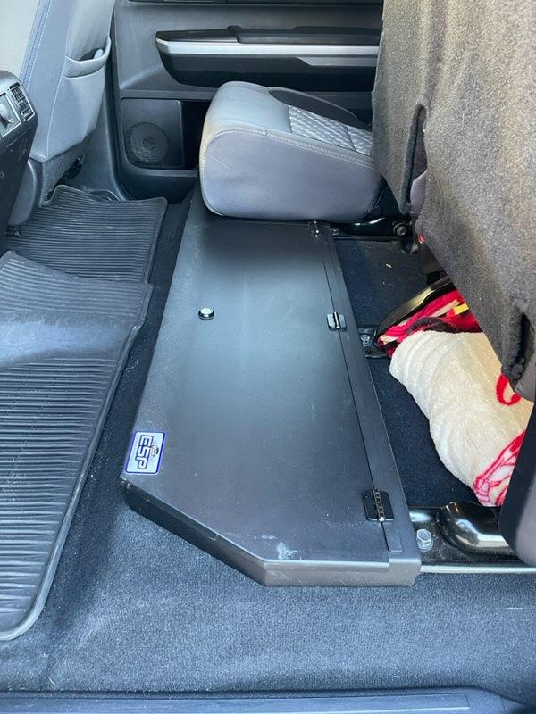 Under seat lockable storage compartment in Toyota Tundra CrewMax with a protective seat cover