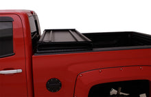 Load image into Gallery viewer, Lund Nissan Titan (5.5ft. Bed) Hard Fold Tonneau Cover w/Bracket Kit - Black