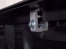 Load image into Gallery viewer, Side profile of Lund Genesis Roll Up Tonneau Cover hardware on a truck