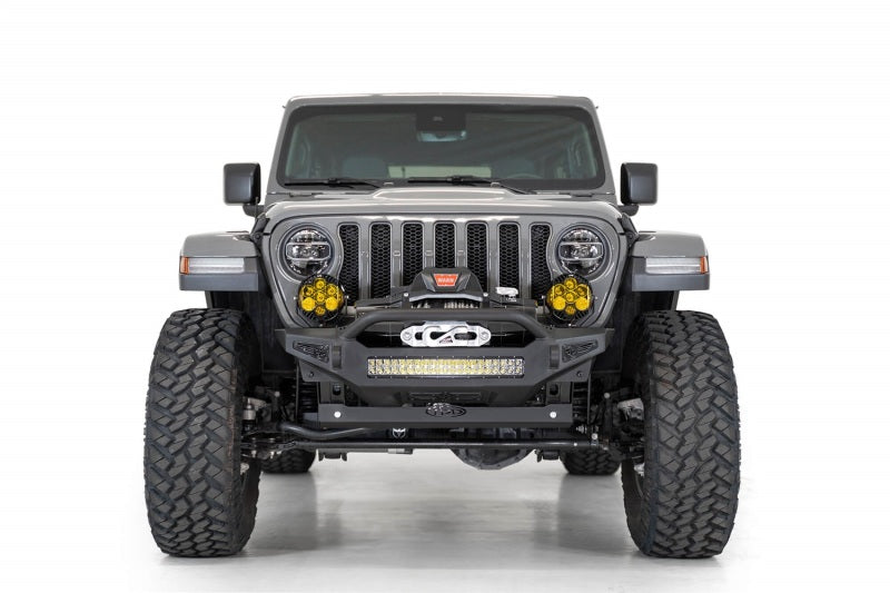 Close-up of a Jeep JL/JT featuring Addictive Desert Designs sway bar skid plate and lighting setup
