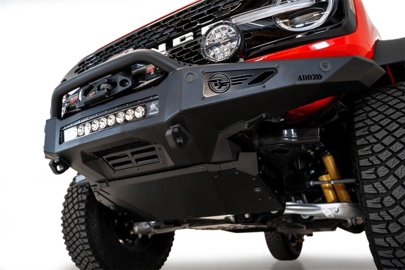 Red Jeep featuring the Addictive Desert Designs Rock Fighter Front Bumper with integrated light bar