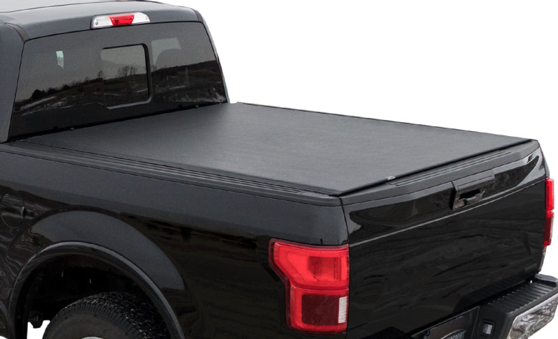 Black Ford Explorer Sport Trac with Access Tonnosport roll-up bed cover