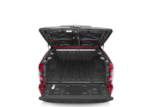 Load image into Gallery viewer, UnderCover Nissan Frontier 5ft Elite Bed Cover - Black Textured