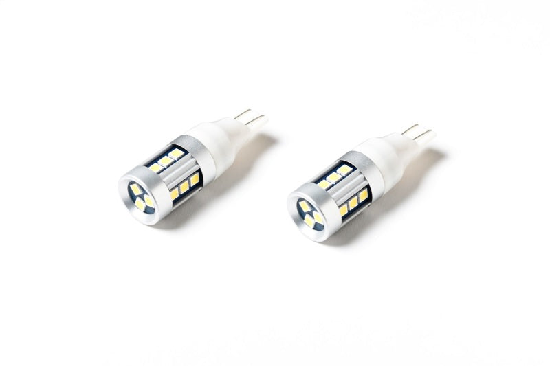 Pair of Putco 921 White Metal 360 LED bulbs displayed on a white background
