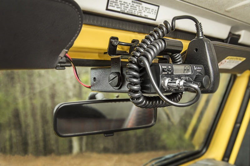 Jeep Wrangler TJ equipped with the Rugged Ridge CB radio mount, showcasing the product in use