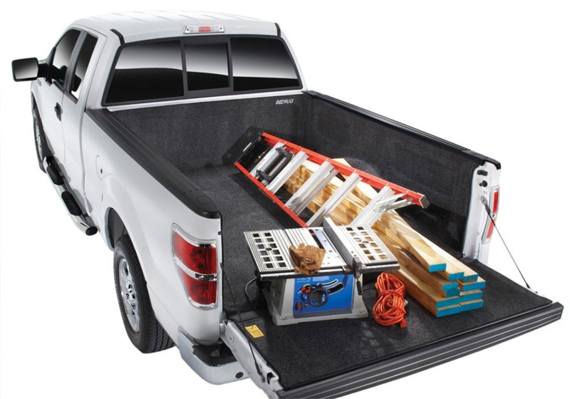 Nissan truck bed with a BedRug liner and an added toolbox